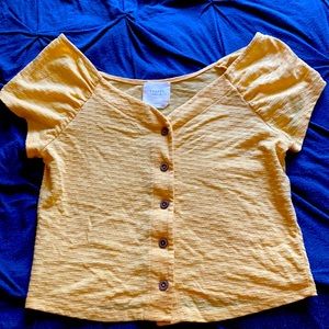 Yellow button-down crop top